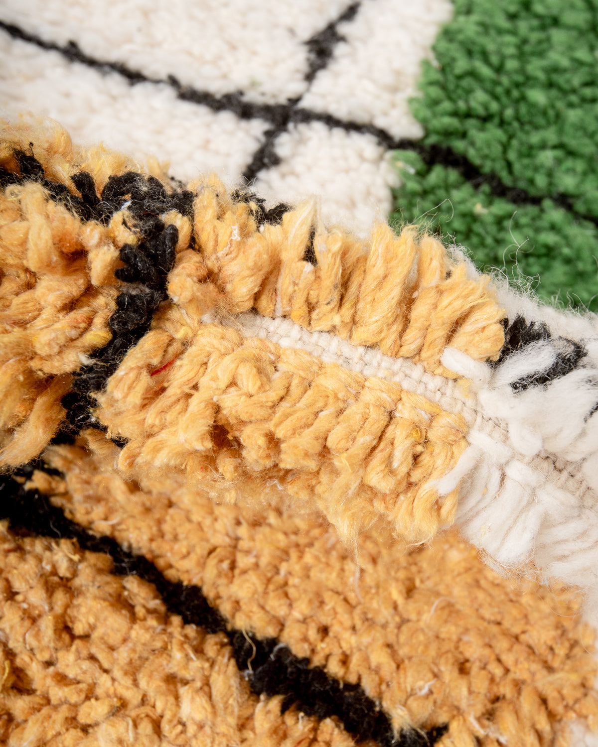 Modern, designer, handcrafted Berber rug from Morocco. Beniourain carpet with beautiful colours and patterns and fluffy wool texture.